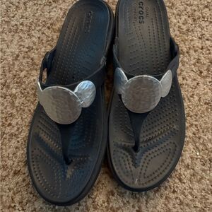 CROCS Black Flip Flops with Silver Disc Accents